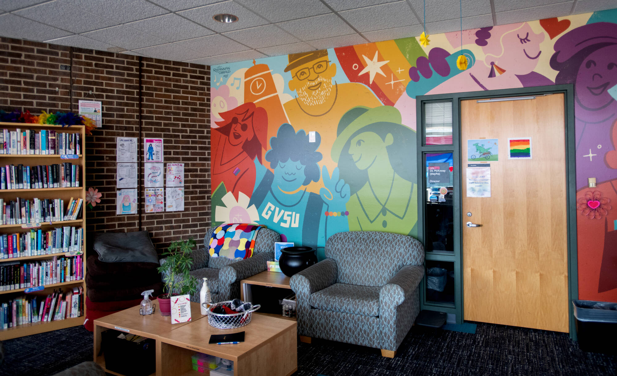 Inside the LGBTRC, colorful mural and cozy chairs